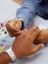 View of medical professional checking the nerve response of a patient