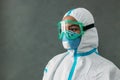 Close up of medical specialist in a protective suit with a respirator
