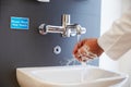 Close Up Of Medical Staff Washing Hands