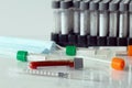 Close-up medical syringe and needle with test tubes for vaccines Royalty Free Stock Photo