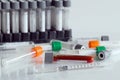 Close-up medical syringe and needle with test tubes for vaccines Royalty Free Stock Photo