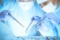 Close-up of medical team performing operation. Group of surgeons at work are busy of patient. Medicine, veterinary or Royalty Free Stock Photo