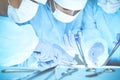 Close-up of medical team performing operation. Group of surgeons at work are busy of patient. Medicine, veterinary or Royalty Free Stock Photo