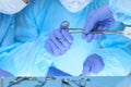 Close up of medical team performing operation. Group of surgeons at work in operating theater Royalty Free Stock Photo