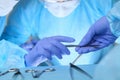 Close up of medical team performing operation. Group of surgeons at work in operating theater Royalty Free Stock Photo