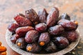 Close up of medjoul - dried dates or kurma in a vintage plate. Royalty Free Stock Photo
