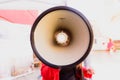 Close-up of a megaphone held by a woman during a demonstration