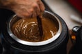 Close up of melted chocolate in a large bowl with a whisk for mixing. A bio homemade hot chocolate with herbs. Royalty Free Stock Photo