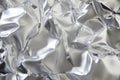 Close-up of melted plastic texture, warped, glossy surface with abstract rippling shapes.