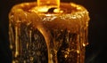 Close-up of a melting candle with wax dripping down the side Royalty Free Stock Photo