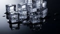 Stack of melting ice cubes with water droplets on a dark reflective surface frozen Royalty Free Stock Photo