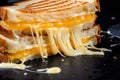 close-up of melty cheese stringing from pressed sandwich