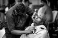 Close-up of men devotee getting tonsured or head shaving ritual in Thaipusam Festival