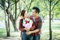 Close-up of a man giving happy woman flowers.A picture of a romantic couple