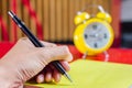 Close up of men hand a pen writing homework text book in library. Education concept Royalty Free Stock Photo