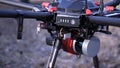 Close-up of men prepared quadcopter for flight. Clip. Two men admire latest version of quadcopter with powerful motors