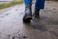 Close up men's boots while hiking on a trail in the mountains. Royalty Free Stock Photo