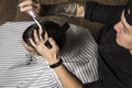 Close up of men`s hairstyling and haircutting in a barber shop . Royalty Free Stock Photo