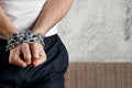 Close-up, men`s hands are chain-bound. The concept of arrest, imprisonment, cumbersome, justice. copy space Royalty Free Stock Photo