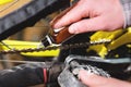 Close-up of men`s hands led by masters grease with special grease bicycle chain of mountain bike in the home workshop Royalty Free Stock Photo
