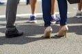 Close up of men and women legs in different shoes, high heels wa Royalty Free Stock Photo