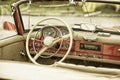Close up on Mercedes vintage car steering wheel and kockpit
