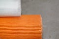 Close Up Mesh Cloth. White and Orange Fiber Glass alkali resistant mesh