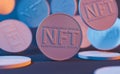 Close-up of messy NFT coins with neon lighting