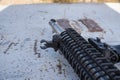 Close up of a metal black rifle with mount holding a scope Royalty Free Stock Photo