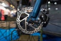 Closeup of a metal brake disc on the front wheel of a mountain bike Royalty Free Stock Photo