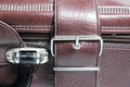 Metal buckle or clasp on an old scratched leather suitcase Royalty Free Stock Photo