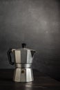 Close up of metal coffee pot on dark wooden table, Royalty Free Stock Photo