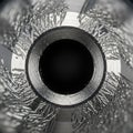 Close-up of a metal drill bit showing its cylindrical hollow center Royalty Free Stock Photo
