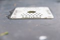 Close up of metal grate with holes on bin for cigarette ends UK Royalty Free Stock Photo