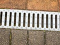 Close up of metal grate on side of floor pavement Royalty Free Stock Photo