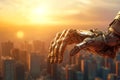 Close-up of the metal hand of an old robot. The mechanized arm of an android on the background of sunset and skyscrapers.