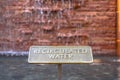 Close up of metal plate with words Recirculated Water embossed on surface Royalty Free Stock Photo