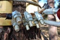 Close-up of metal ropes held together by clamps and bolts, steel wire rope and metal clamp are part of structure of rope park