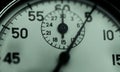 Close up of metal rusty vintage stopwatch in dim light. Hard times concept. Royalty Free Stock Photo