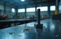 Close-up metal screw and nut on workshop table in industrial setting. Detail of steel bolt, precision engineering components in Royalty Free Stock Photo