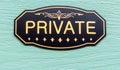 Close up of a metal sign saying `Private` in gold letters