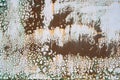 Close-up of a metal or steel plate, covered with old paint. Cracking and flaking paint on rusty iron background. Royalty Free Stock Photo