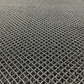 A close-up of a metal wire mesh with a grid pattern. The wires intersect at right angle Royalty Free Stock Photo