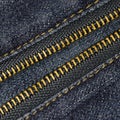 Close up metal zipper openning on blue jean. Royalty Free Stock Photo