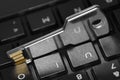 Key shape USB flash on a black computer keyboard. Royalty Free Stock Photo