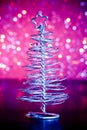 Close-up of metallic modern christmas tree on wood table Royalty Free Stock Photo