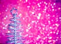 Close-up of metallic modern christmas tree on wood table Royalty Free Stock Photo