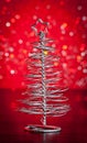 Close-up of metallic modern christmas tree on wood table Royalty Free Stock Photo