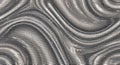 Close-up of metallic swirling pattern with reflective surface Royalty Free Stock Photo