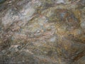 Close up of Metamorphic rocks with colorful mineral streaks. T